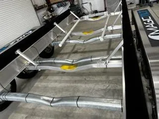 Slide: The Image of 2023 Grady-White Freedom 335 boat trailer in a garage setting. - 48
