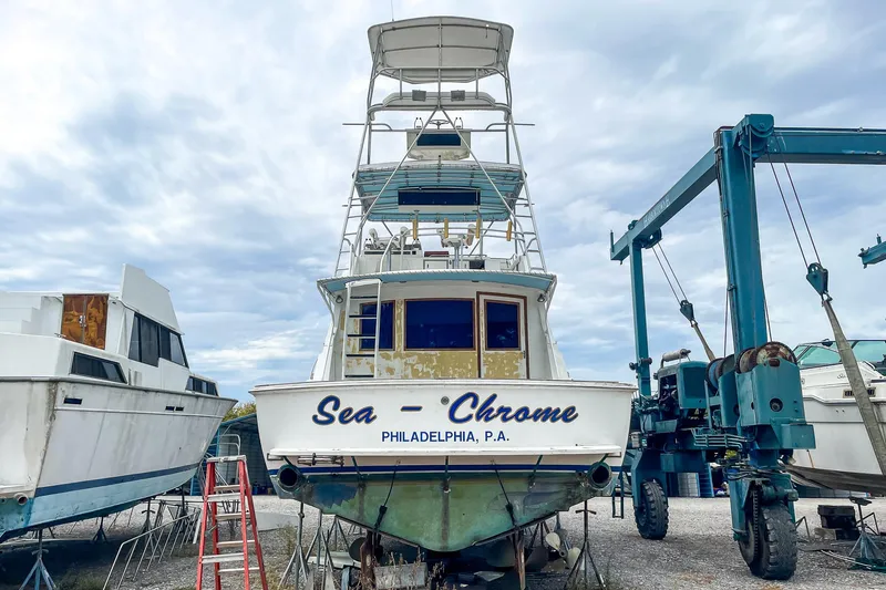 Slide: The Image of 1978 Bertram 46 Convertible boat named "Sea Chrome" in a boatyard, Philadelphia, PA. - 19