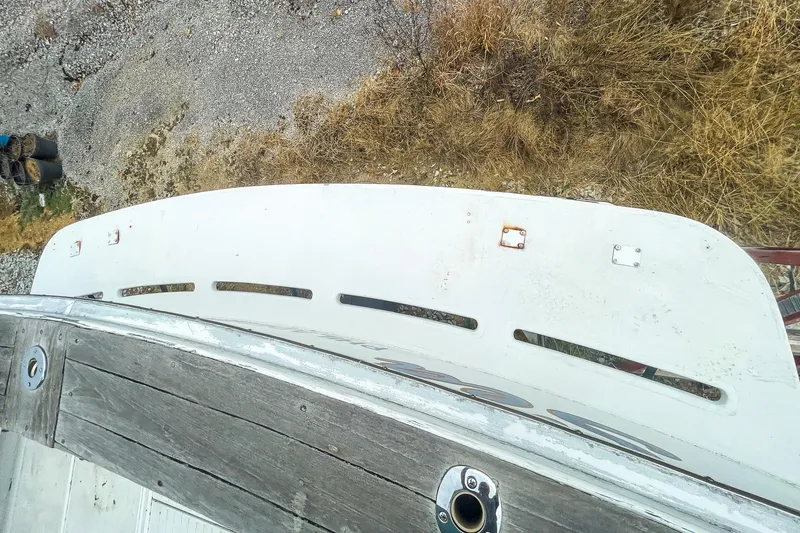 Slide: The Image of 1978 Bertram 46 Convertible boat deck with weathered wood and metal fittings. - 29