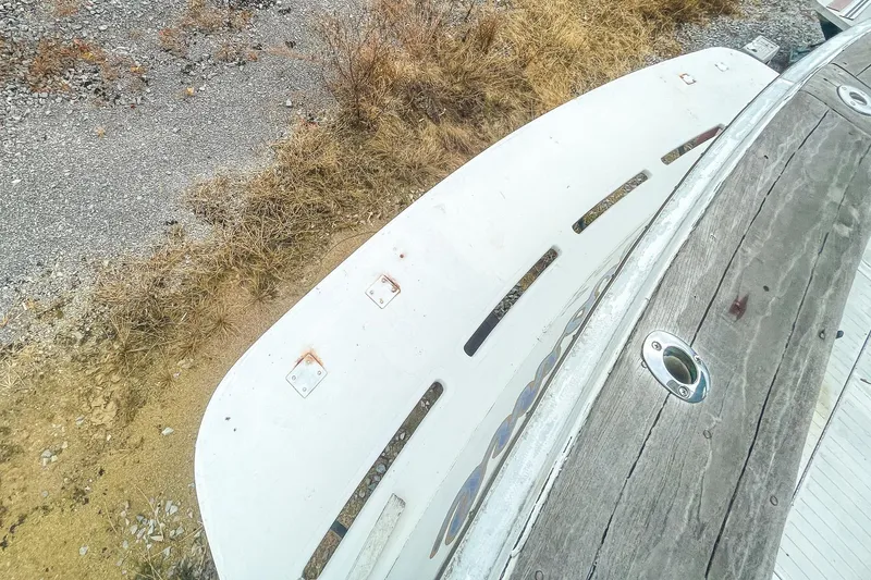 Slide: The Image of 1978 Bertram 46 Convertible boat deck with weathered wood and metal fittings. - 30