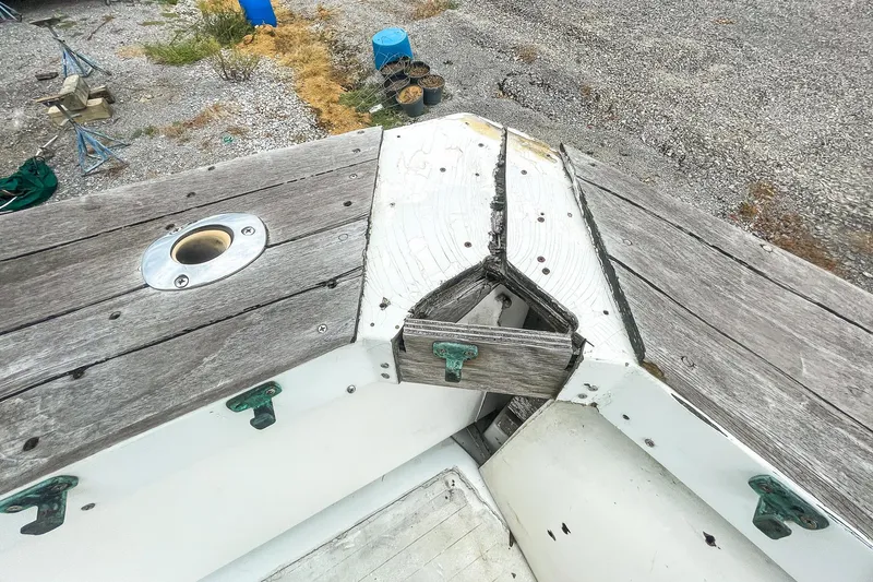 Slide: The Image of 1978 Bertram 46 Convertible boat deck with weathered wood and metal fittings. - 31