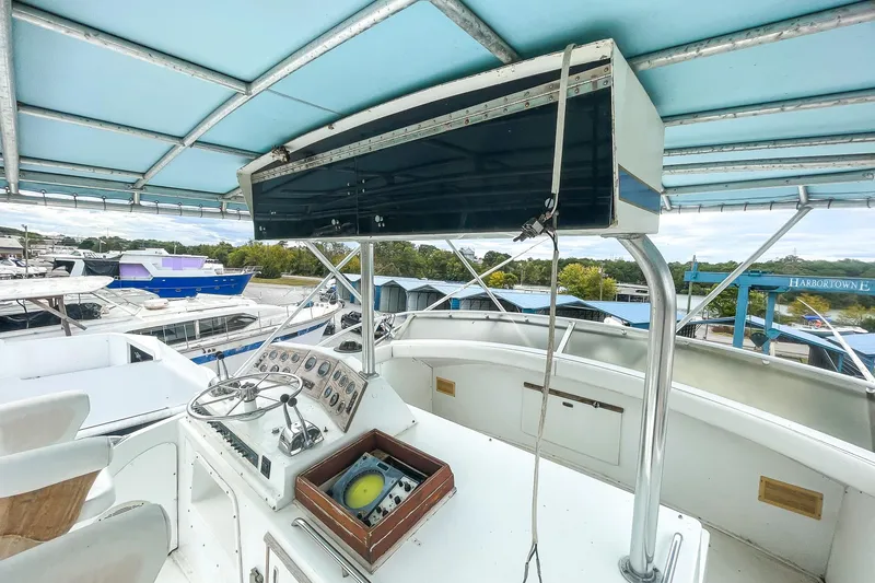 Slide: The Image of 1978 Bertram 46 Convertible yacht helm with canopy and control panel. - 41