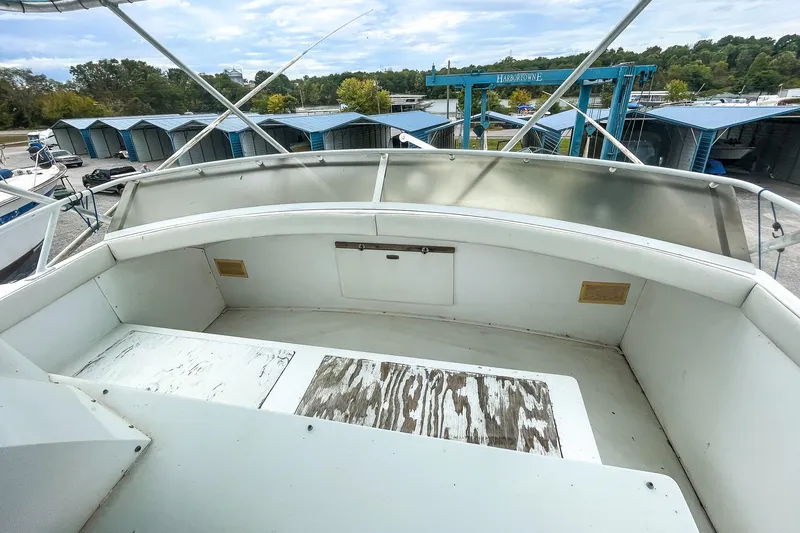 Slide: The Image of 1978 Bertram 46 Convertible boat deck with marina background. - 42