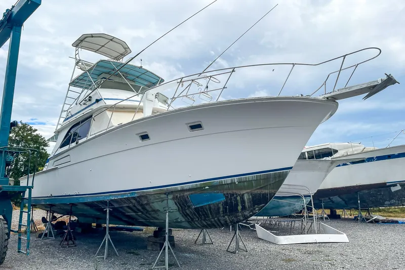 Slide: The Image of 1978 Bertram 46 Convertible yacht on dry dock, ready for maintenance. - 6