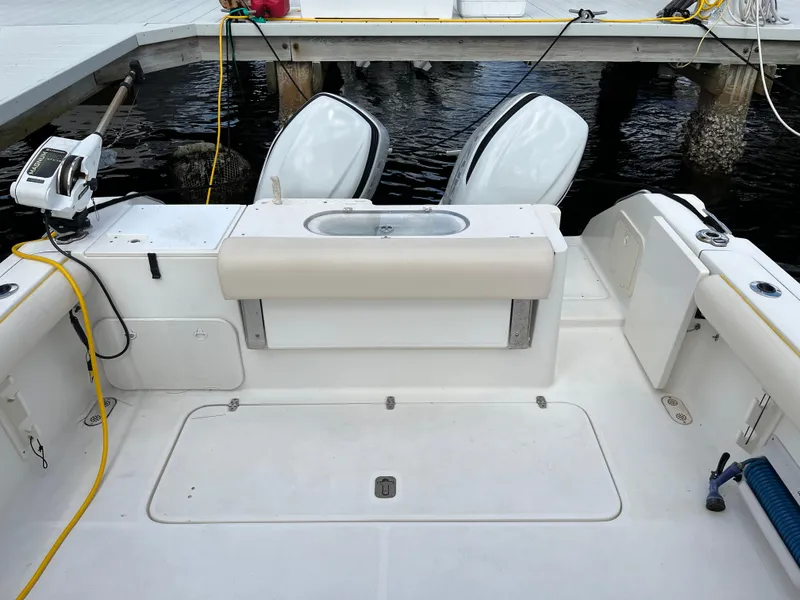 Slide: The Image of 2005 Pursuit 3070 WA EXPRESS boat with dual engines at dock. - 12