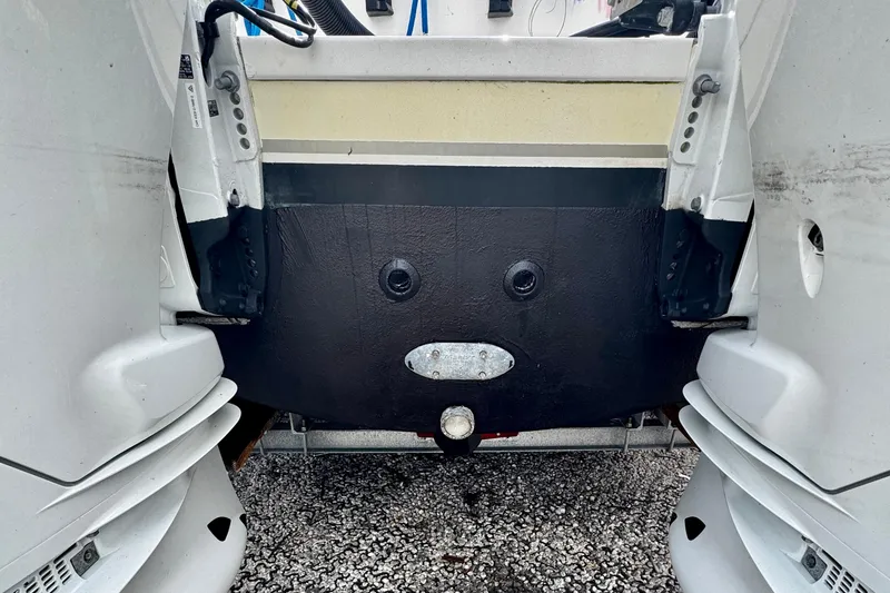 Slide: The Image of 2005 Pursuit 3070 WA EXPRESS boat transom with dual outboard motors. - 23