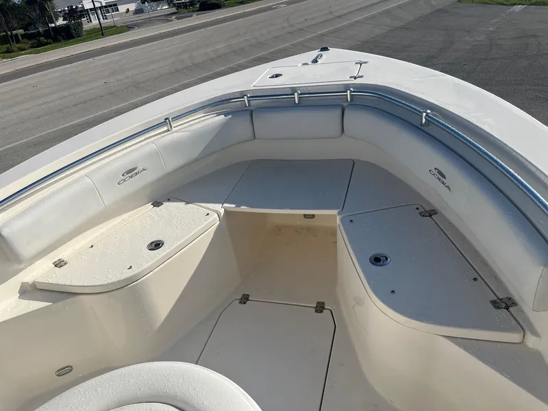 Slide: The Image of 2022 Cobia 237 Center Console boat interior with seating and storage compartments. - 5