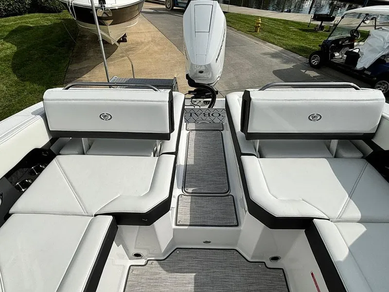Slide: The Image of 2025 Cobalt R6 Outboard boat interior with white seating and modern design. - 12