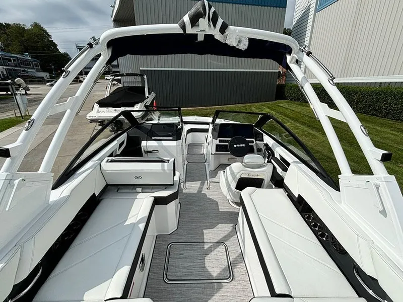 Slide: The Image of 2025 Cobalt R6 Outboard boat interior with sleek white seating and modern design. - 13