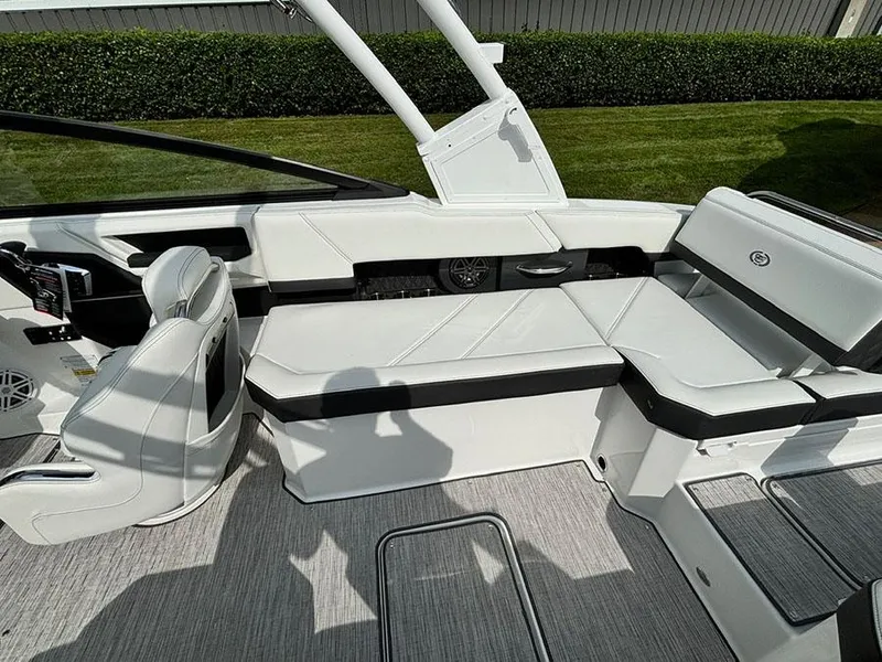 Slide: The Image of 2025 Cobalt R6 Outboard interior with white seating and modern design. - 14
