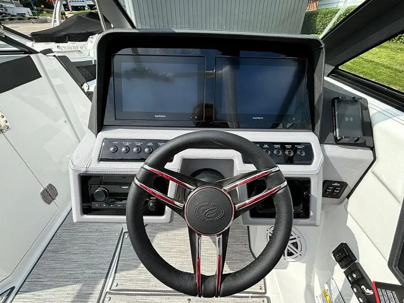 Slide: The Image of 2025 Cobalt R6 Outboard dashboard with dual screens and modern steering wheel. - 16