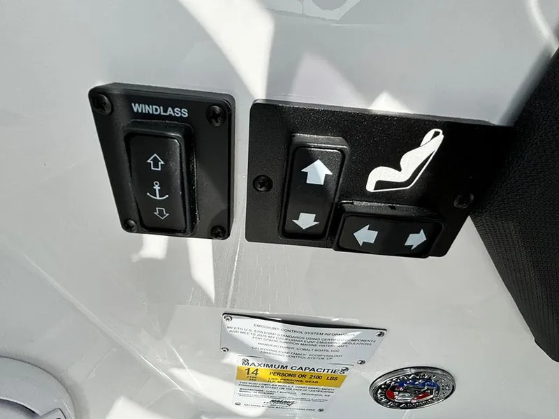 Slide: The Image of Control panel of 2025 Cobalt R6 Outboard boat with windlass and seat adjustment buttons. - 19