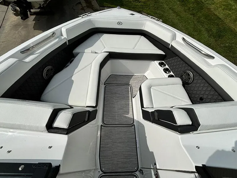 Slide: The Image of 2025 Cobalt R6 Outboard boat interior with sleek white seating and modern design. - 24
