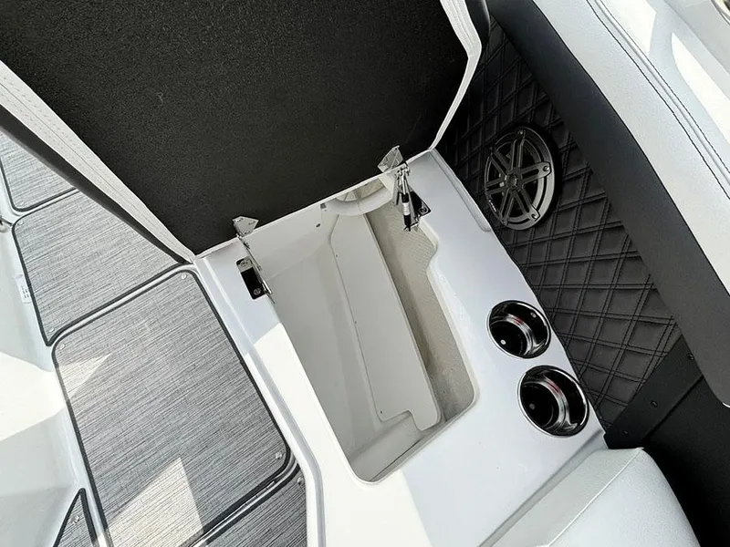 Slide: The Image of 2025 Cobalt R6 Outboard boat interior with storage compartment and cup holders. - 25