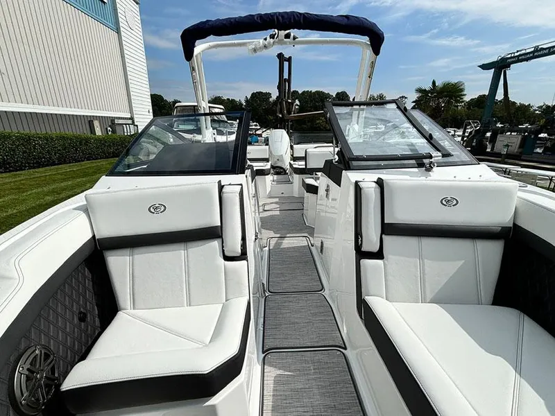 Slide: The Image of 2025 Cobalt R6 Outboard boat interior with white seating and modern design. - 26