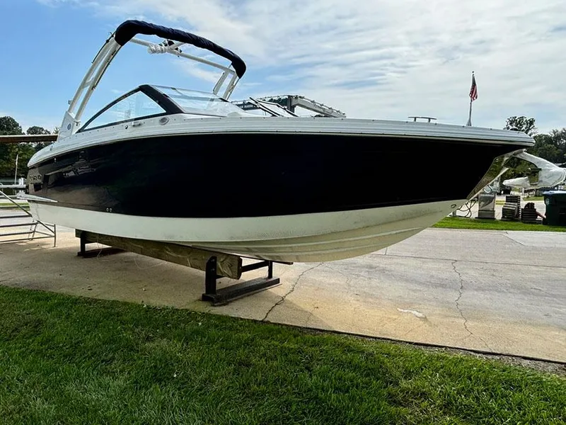 Slide: The Image of 2025 Cobalt R6 Outboard boat displayed on a stand, showcasing sleek design. - 4