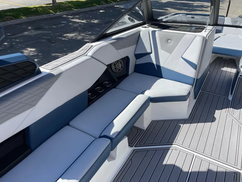 Slide: The Image of 2023 Nautique Super Air Nautique S25 interior with sleek seating and modern design. - 10