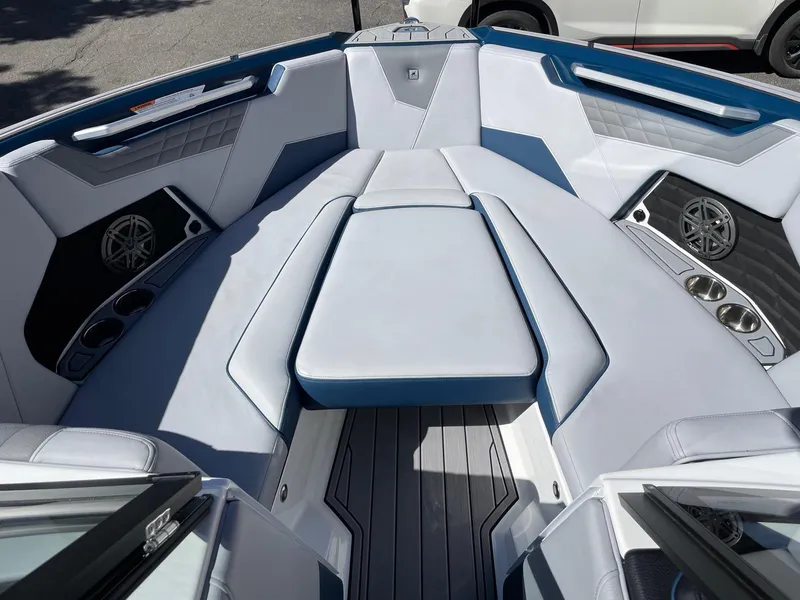 Slide: The Image of 2023 Nautique Super Air Nautique S25 boat interior with sleek seating and modern design. - 11