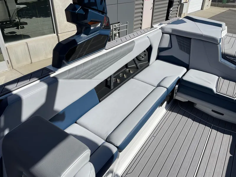 Slide: The Image of 2023 Nautique Super Air Nautique S25 interior with sleek gray seating and modern design. - 7