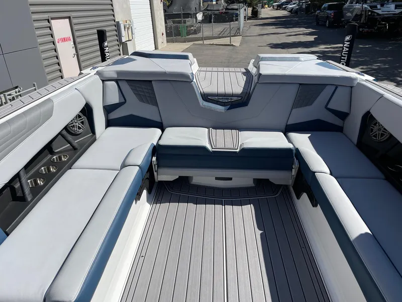 Slide: The Image of 2023 Nautique Super Air Nautique S25 interior with spacious seating and modern design. - 8