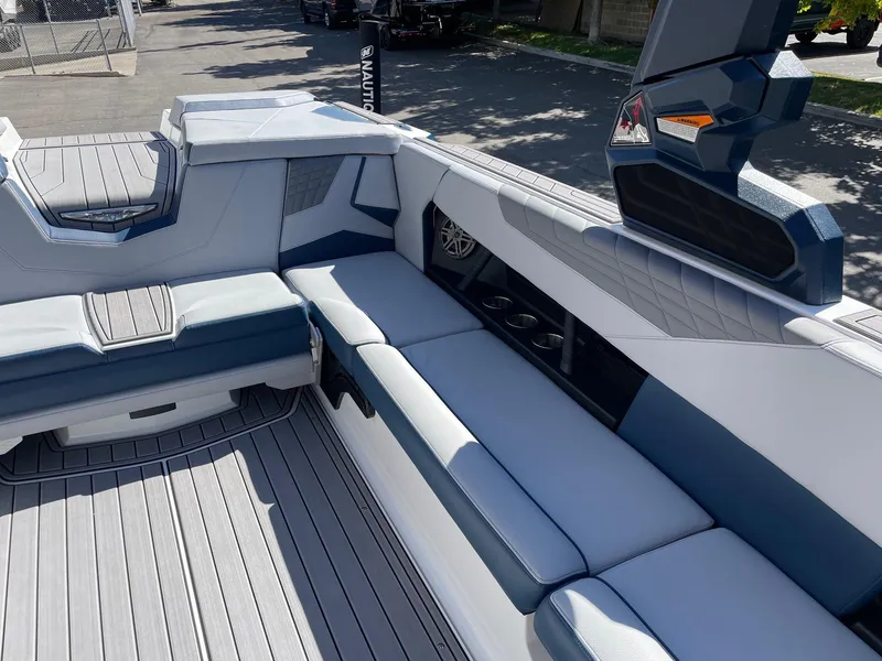 Slide: The Image of 2023 Nautique Super Air Nautique S25 interior with sleek seating and modern design. - 9