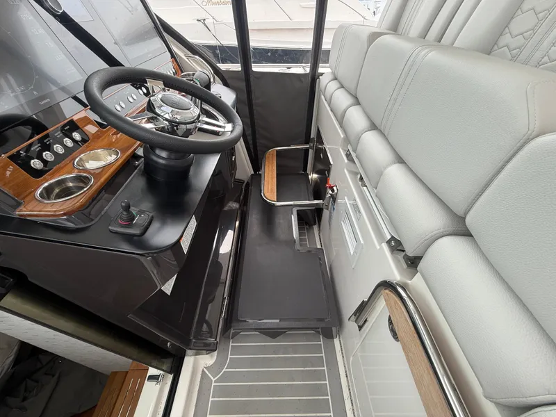 Slide: The Image of 2023 Tiara Yachts 38 LS helm with modern controls and comfortable seating. - 27