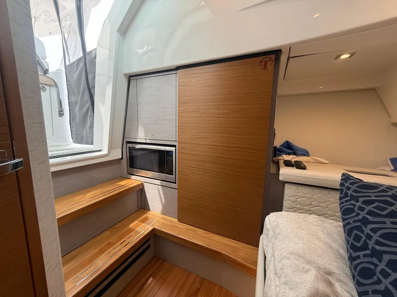 Slide: The Image of Electrical panel, microwave, and hanging locker - 33