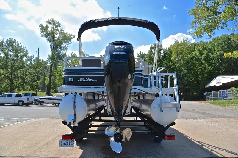 Slide: The Image of 2021 Sun Tracker Fishin Barge 20 DLX pontoon boat on trailer, rear view. - 13