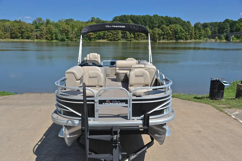 Slide: The Image of 2021 Sun Tracker Fishin Barge 20 DLX pontoon boat by a serene lake. - 17