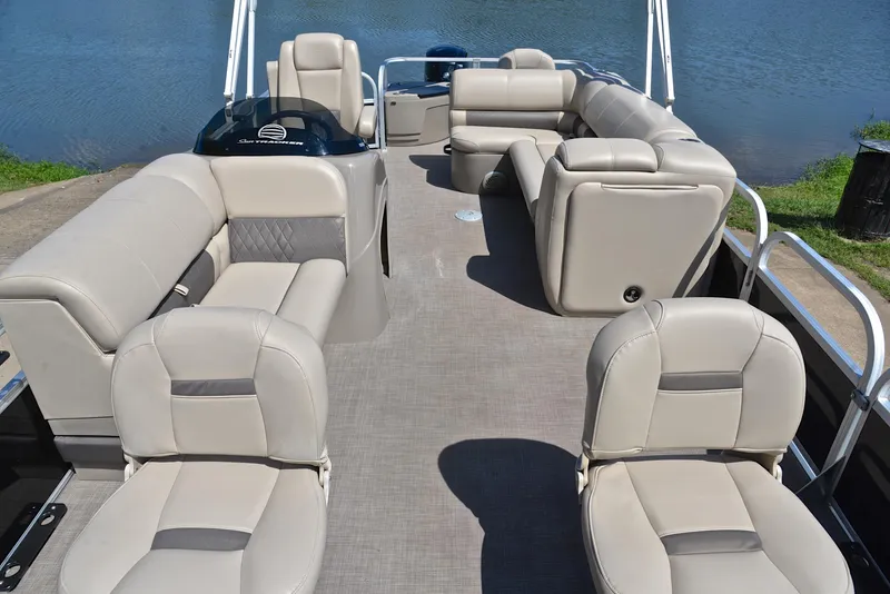 Slide: The Image of 2021 Sun Tracker Fishin Barge 20 DLX interior with beige seating and spacious layout. - 20