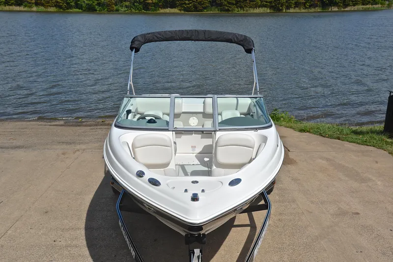 Slide: The Image of 2008 Chaparral 190 SSi boat on trailer by a lake. - 17