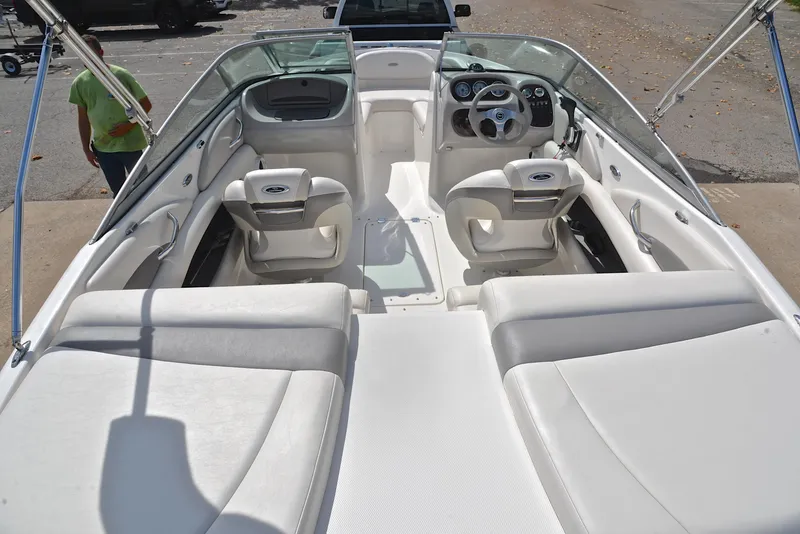 Slide: The Image of 2008 Chaparral 190 SSi boat interior with white seating and dashboard. - 18