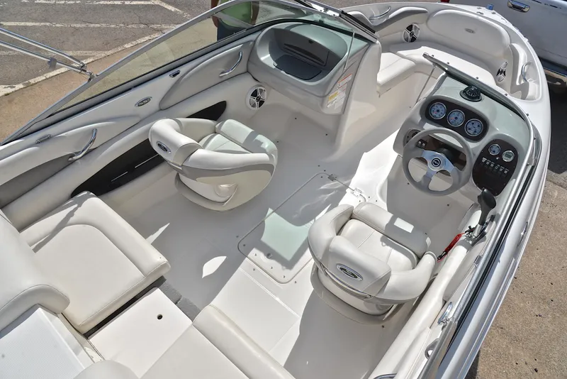 Slide: The Image of 2008 Chaparral 190 SSi boat interior with white seating and dashboard. - 19