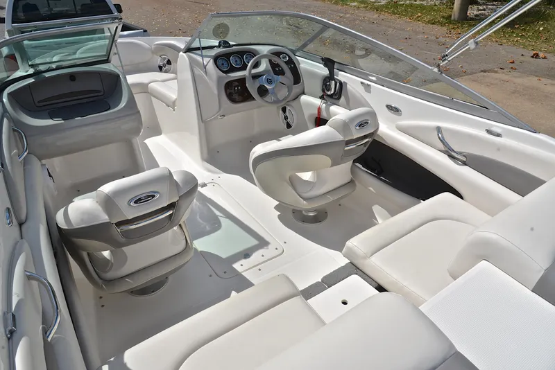Slide: The Image of 2008 Chaparral 190 SSi boat interior with white seating and steering console. - 23