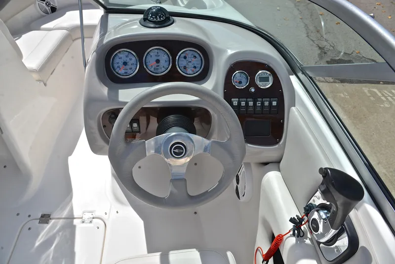 Slide: The Image of 2008 Chaparral 190 SSi boat dashboard with steering wheel and gauges. - 24