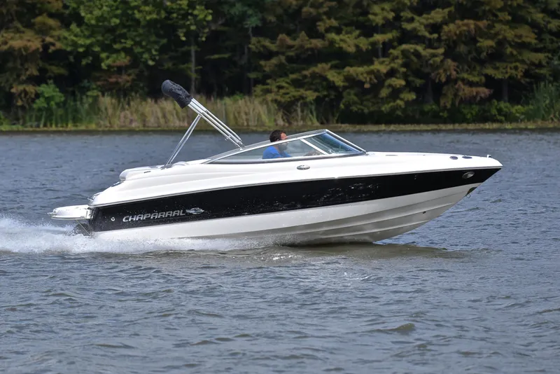 Slide: The Image of 2008 Chaparral 190 SSi speedboat cruising on a lake with forested background. - 3