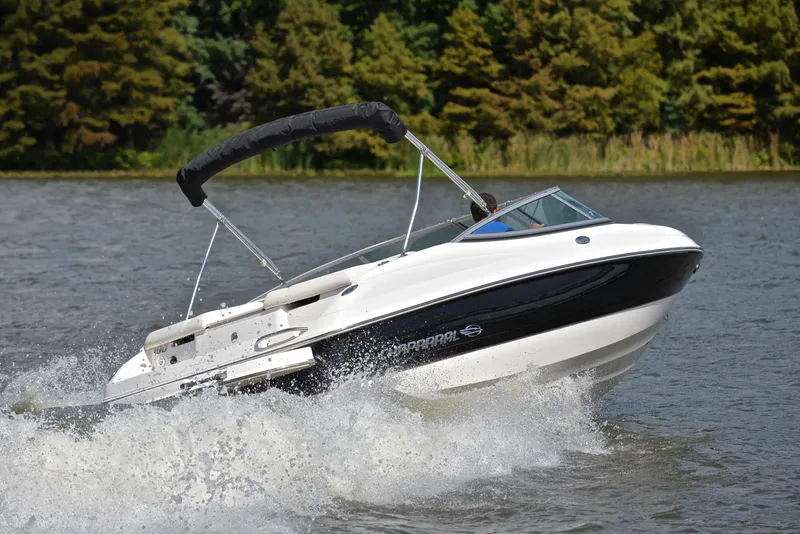 Slide: The Image of 2008 Chaparral 190 SSi speedboat cruising on a lake with trees in the background. - 5