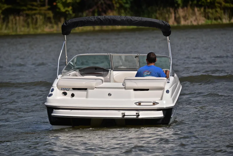 Slide: The Image of 2008 Chaparral 190 SSi boat cruising on a lake with a person onboard. - 8