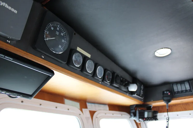 Slide: The Image of Control panel of a 2001 Nordhavn 40 boat with gauges and navigation equipment. - 10