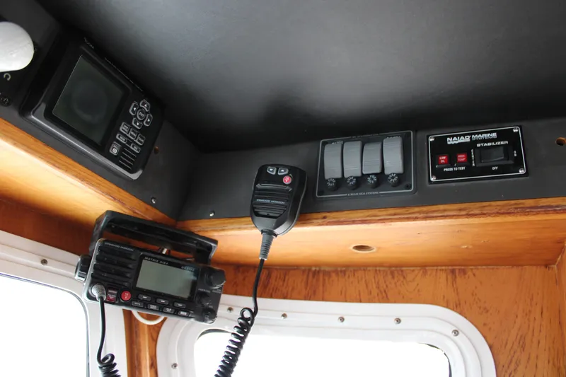 Slide: The Image of Control panel of a 2001 Nordhavn 40 boat with communication equipment. - 11