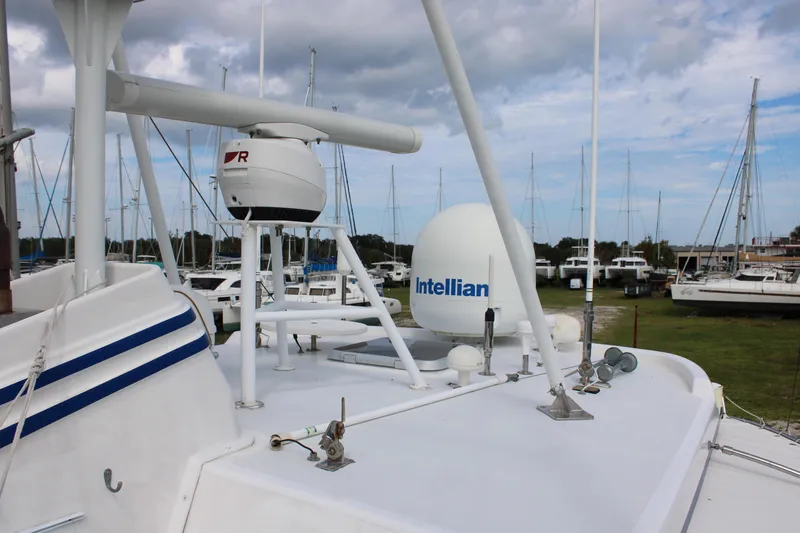 Slide: The Image of Nordhavn 40 yacht, 2001 model, featuring Intellian satellite equipment on deck. - 26