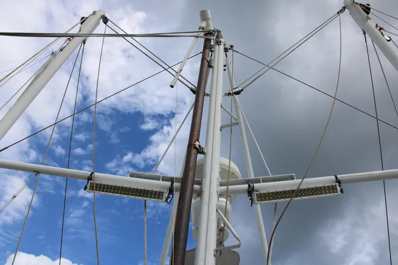 Slide: The Image of Nordhavn 40 sailboat mast against cloudy sky, 2001 model. - 28