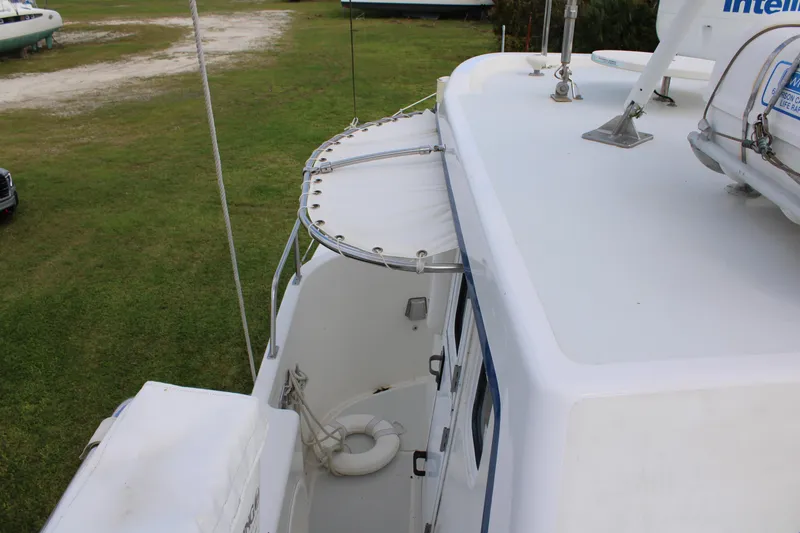 Slide: The Image of 2001 Nordhavn 40 boat deck view with lifebuoy and canopy. - 30