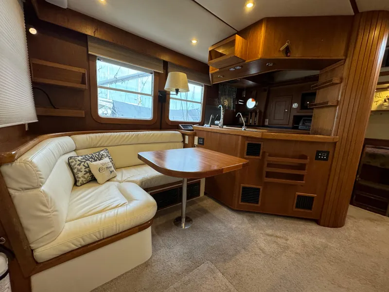 Slide: The Image of Luxurious 2001 Nordhavn 40 yacht interior with cozy seating and elegant wood finishes. - 34