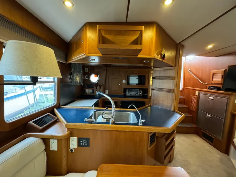 Slide: The Image of Interior of 2001 Nordhavn 40 yacht with modern kitchen and wooden cabinetry. - 37