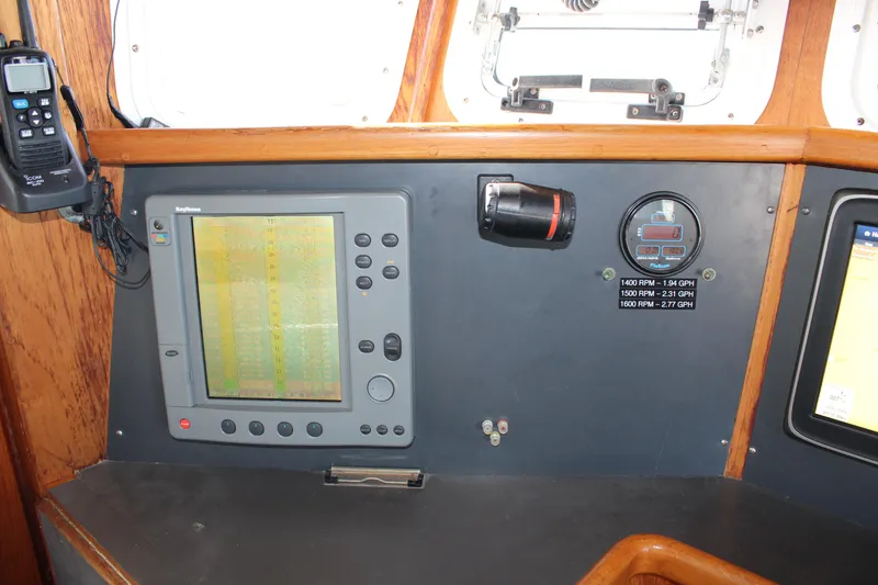 Slide: The Image of Control panel of a 2001 Nordhavn 40 boat with navigation equipment and gauges. - 45