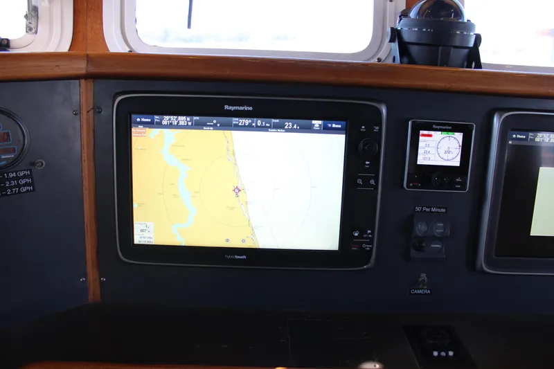 Slide: The Image of Navigation system on 2001 Nordhavn 40 yacht, featuring Raymarine display and controls. - 46
