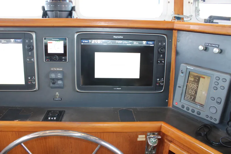Slide: The Image of Control panel of a 2001 Nordhavn 40 yacht with navigation screens and instruments. - 47