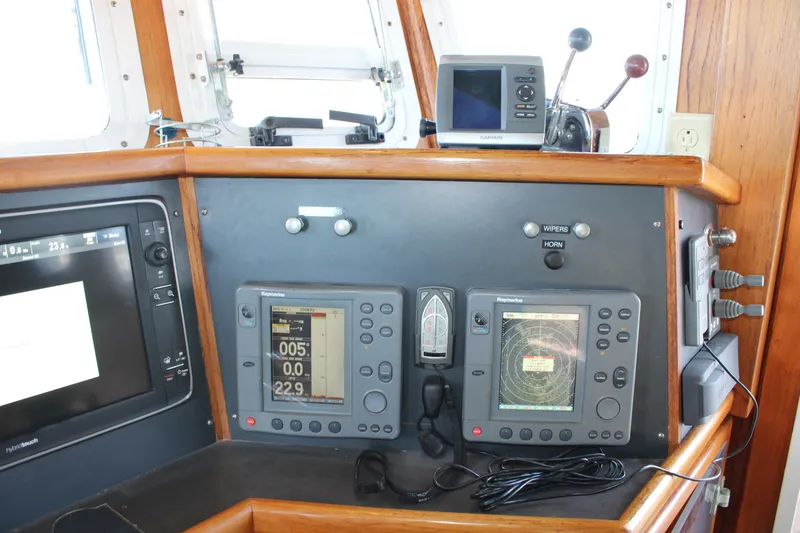 Slide: The Image of Navigation equipment on a 2001 Nordhavn 40 yacht's control panel. - 48