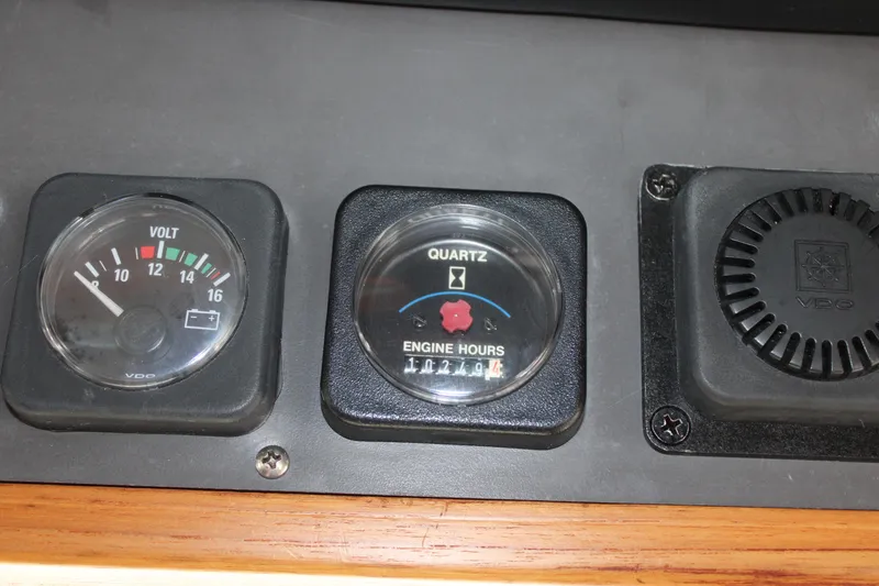 Slide: The Image of Control panel of a 2001 Nordhavn 40 boat showing voltmeter and engine hours. - 6